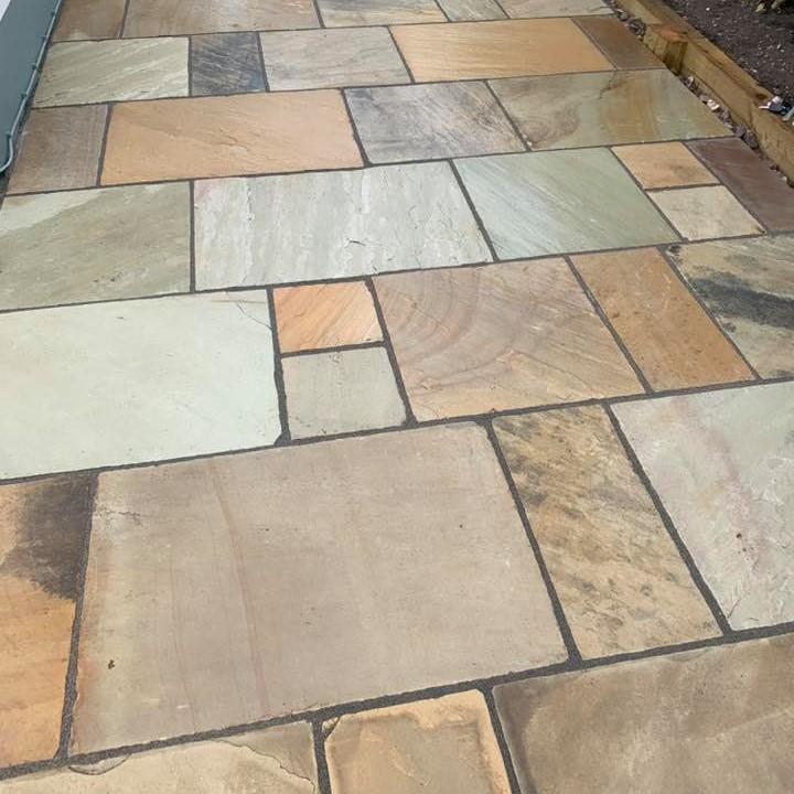 dark jointing grout with natural stone paving