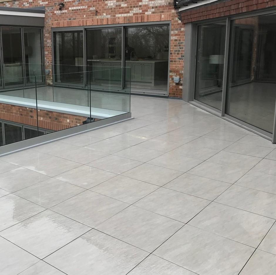 grey porcelain paving outside house