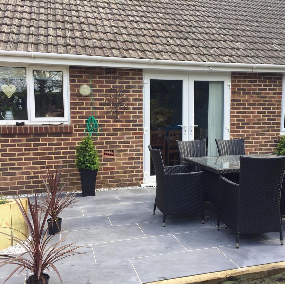 Quartz Anthracite Porcelain Paving back garden patio with furniture