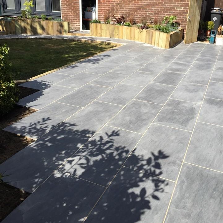 Quartz Anthracite Porcelain Paving with sleepers in back garden