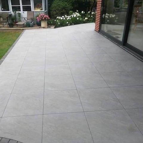 Quartz Anthracite Porcelain Paving in garden with lawn and plants