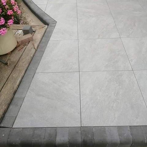 Quartz Anthracite Porcelain Paving with cobbles and flowers