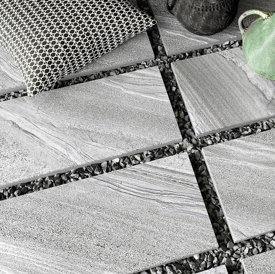 Spectrum Quartzite Grey Porcelain Paving with dark jointing back garden patio