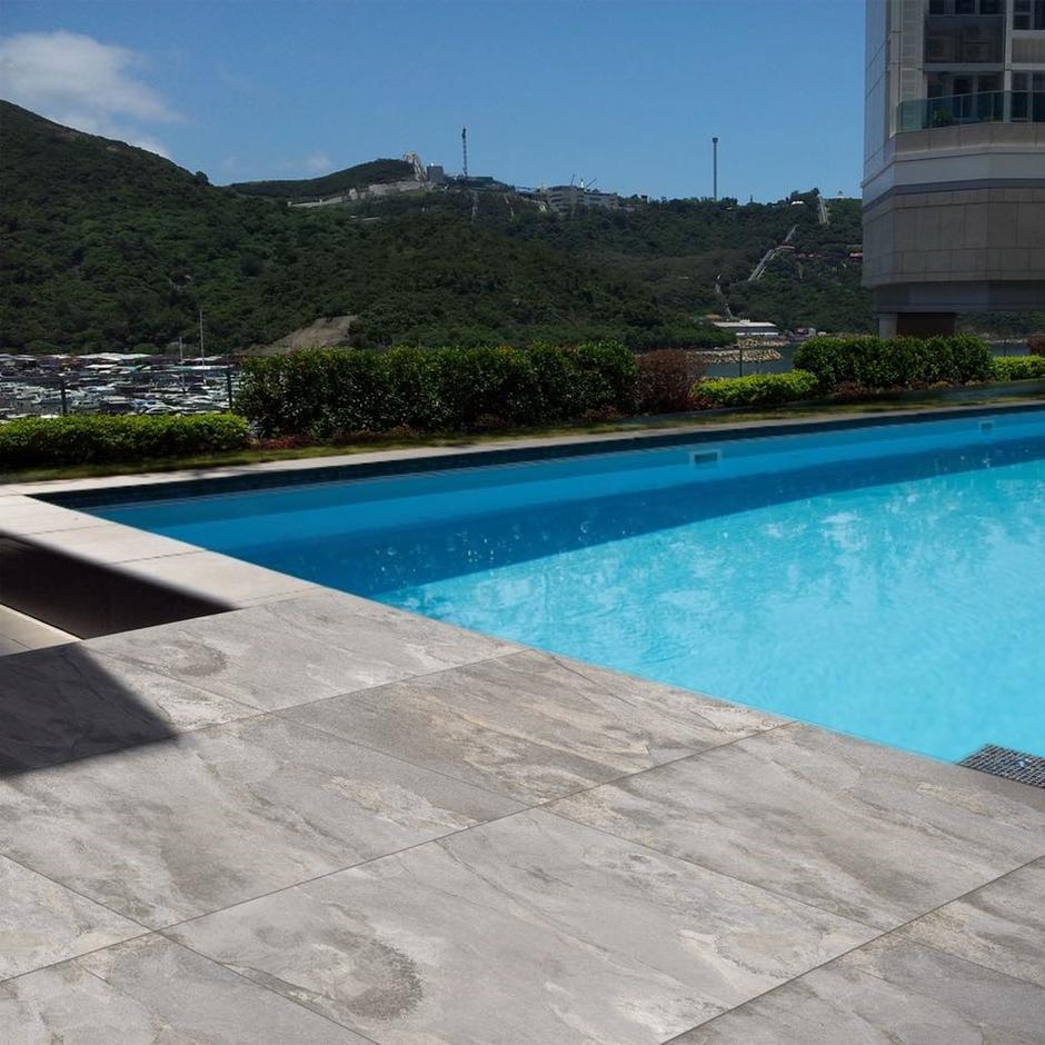 marbled grey paving by a pool