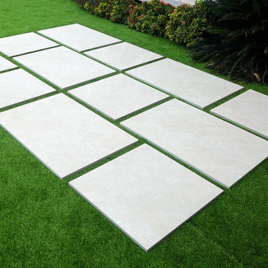 Sienna™ Quartz White Porcelain Paving slabs in garden
