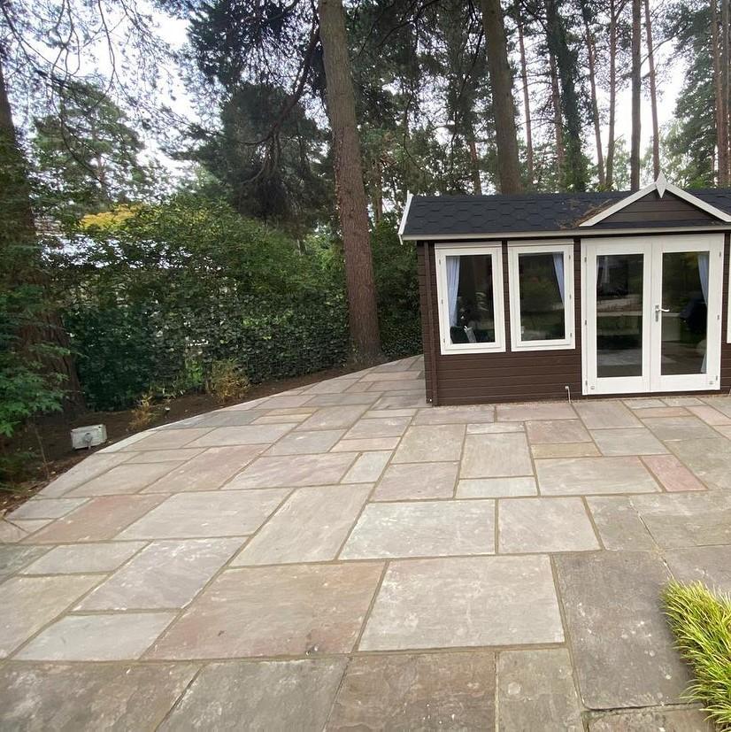 back garden shed, light brown paving slabs