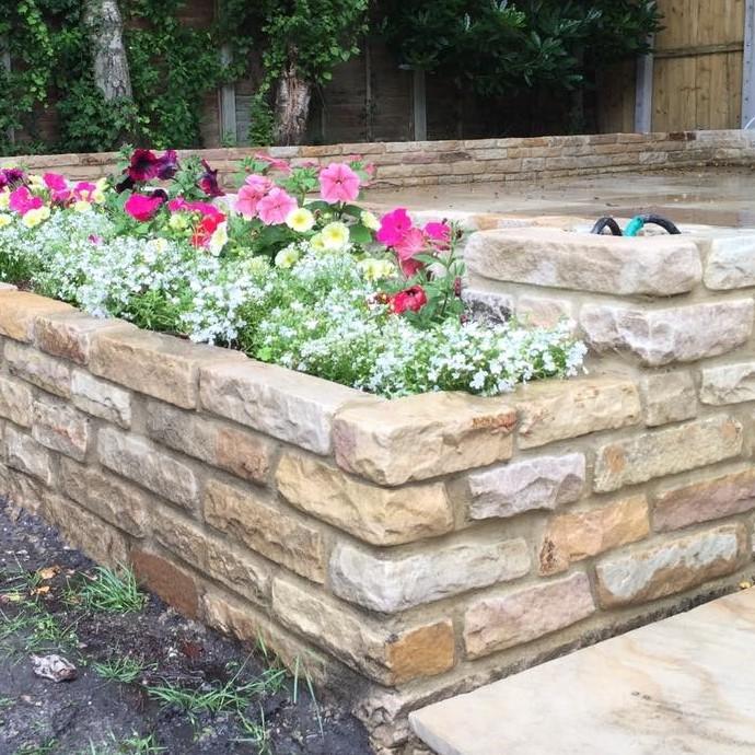 Golden Fossil Sandstone Walling retaining plant bed