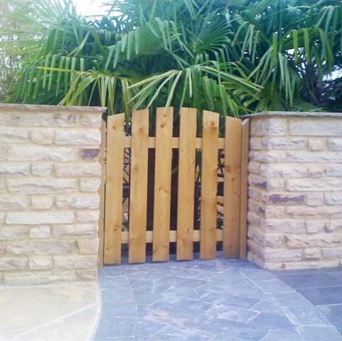 Golden Fossil Sandstone Walling with wooden gate