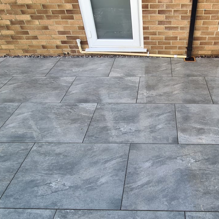 grey marble paving against garden wall