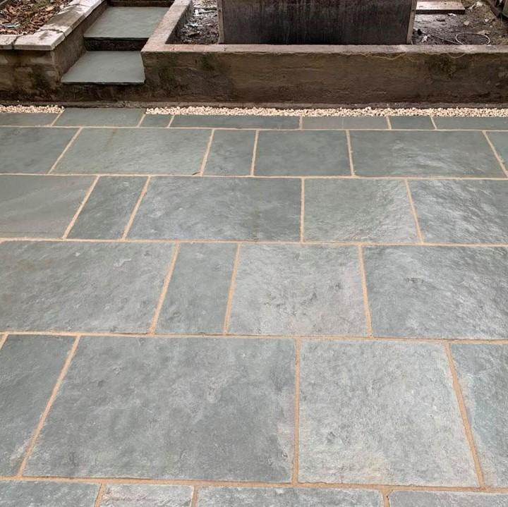 limestone paving in light blue and light grey with grouting