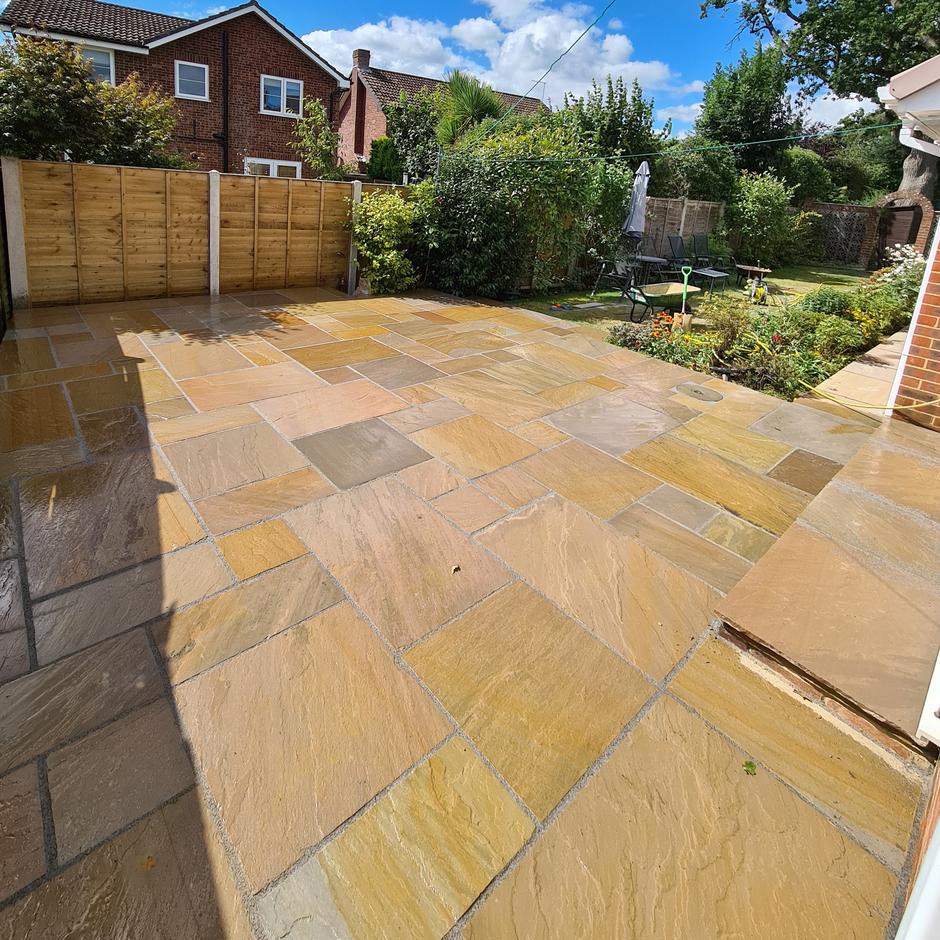 Light brown sandstone paving in back garden