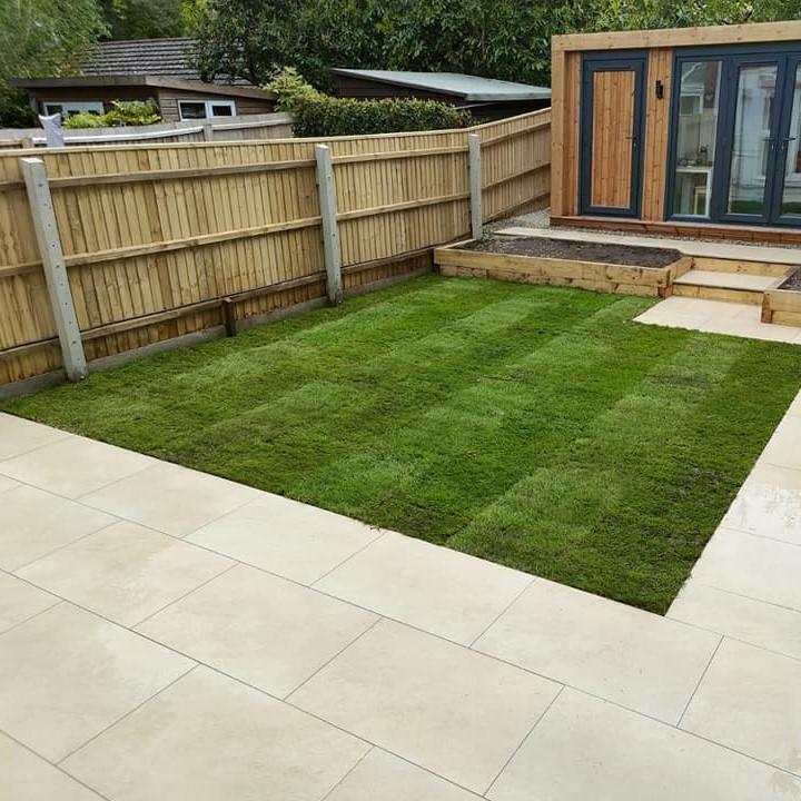 cappuccino paving in garden with grass and shed