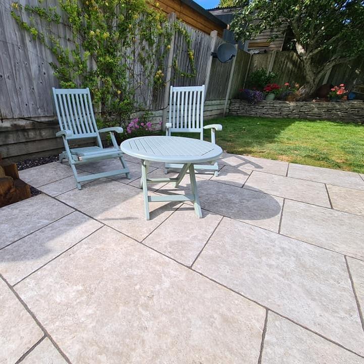 Travertine Silver Weathered Porcelain Paving back garden patio with garden dining furniture