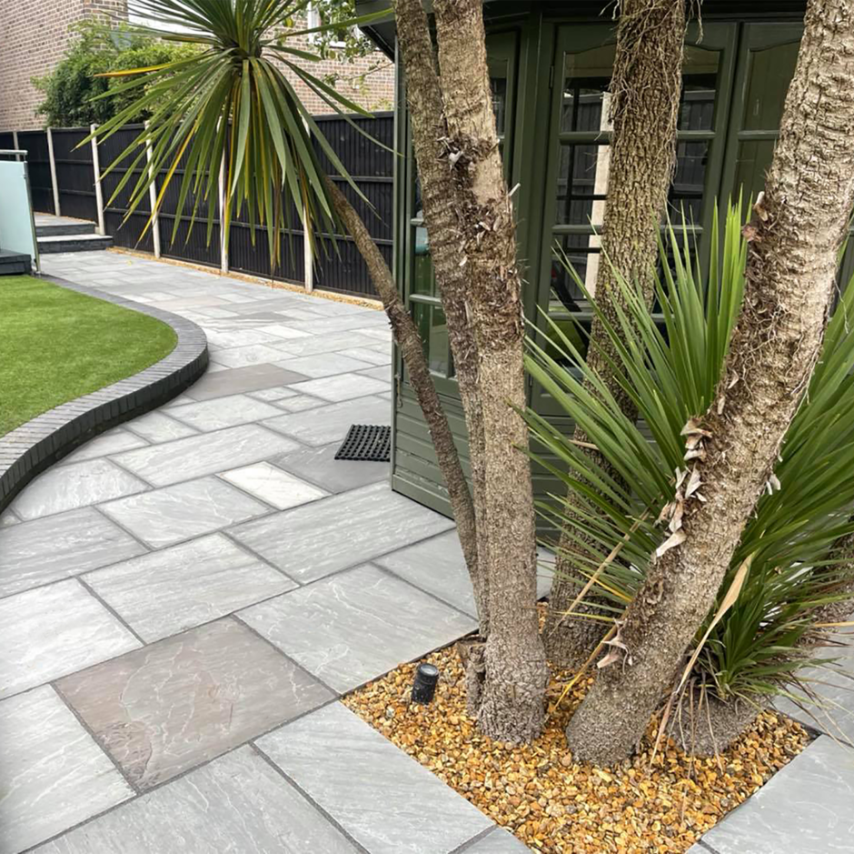 grey paving with trees