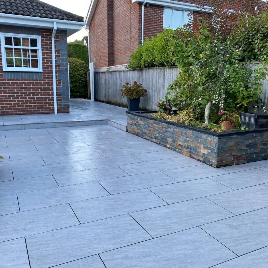 quartz grey paving with stone walling