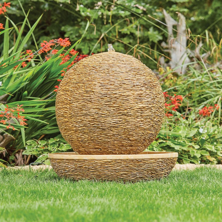 Cotswold sun water feature in garden