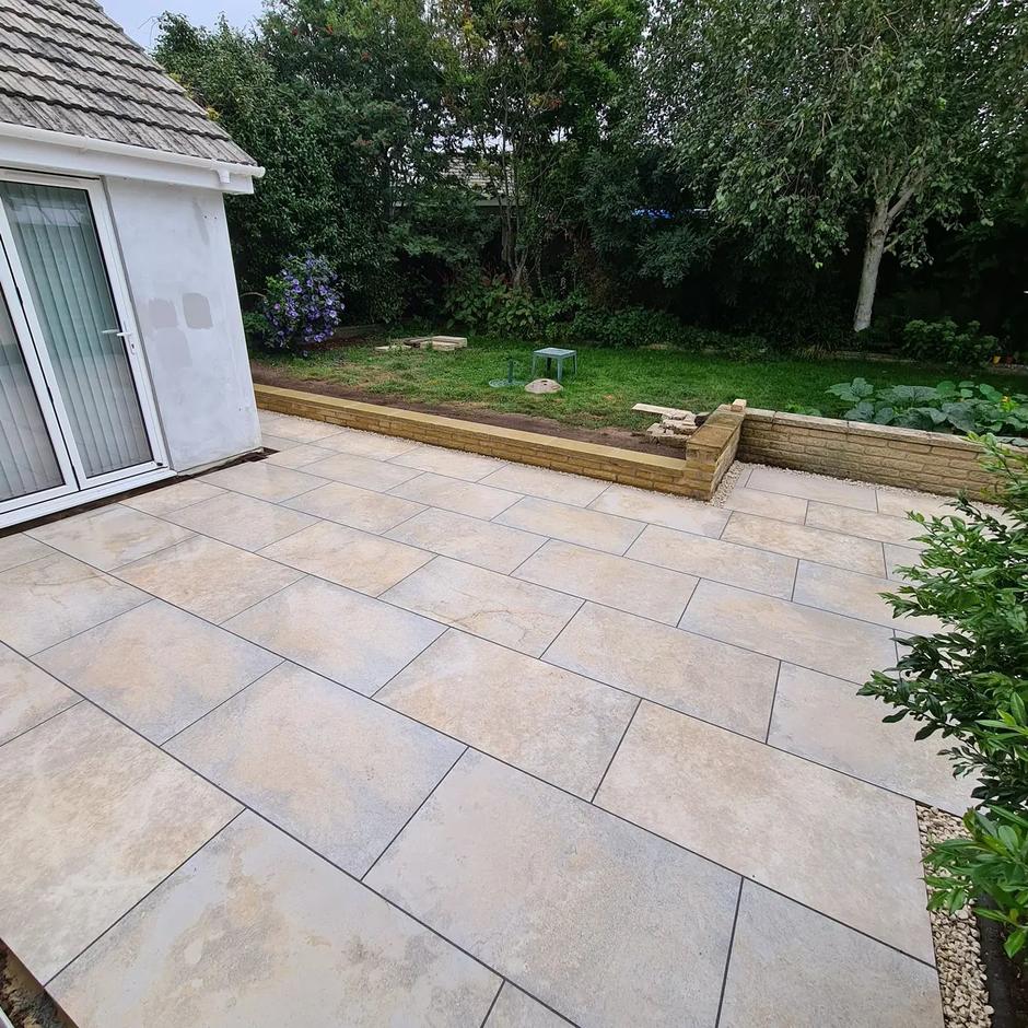 gold beige porcelain paving slabs with retaining wall