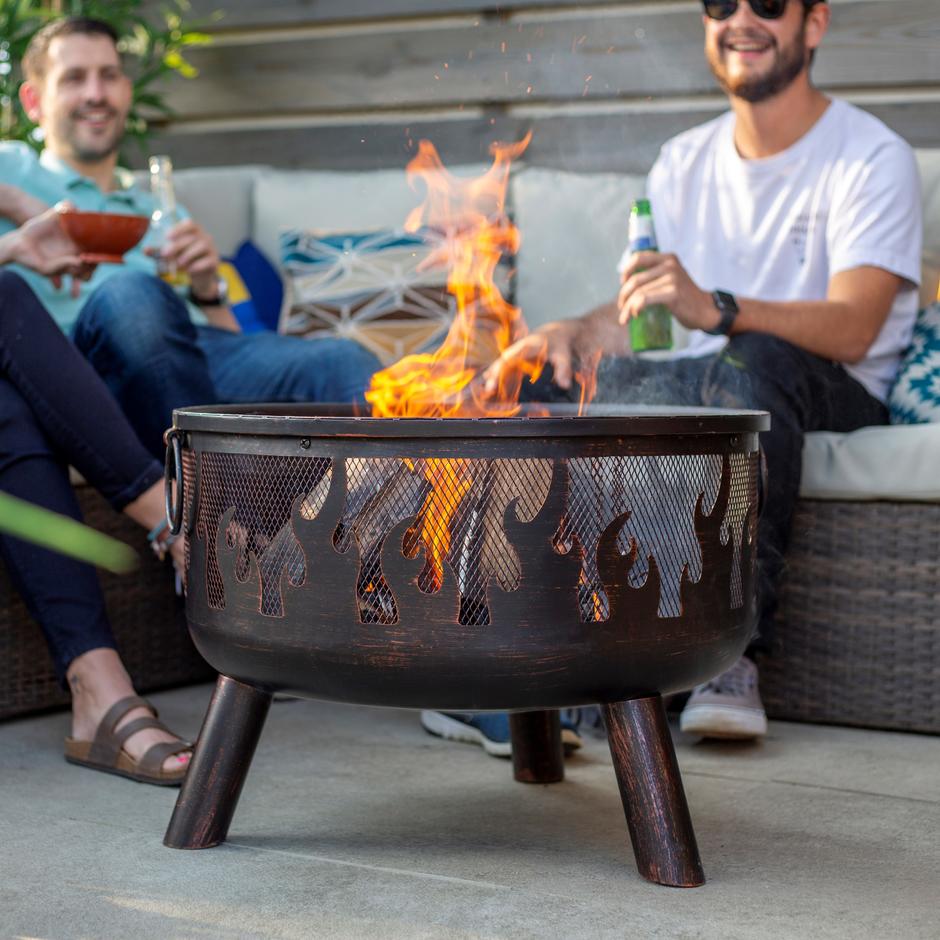people in garden enjoying Wildfire firepit