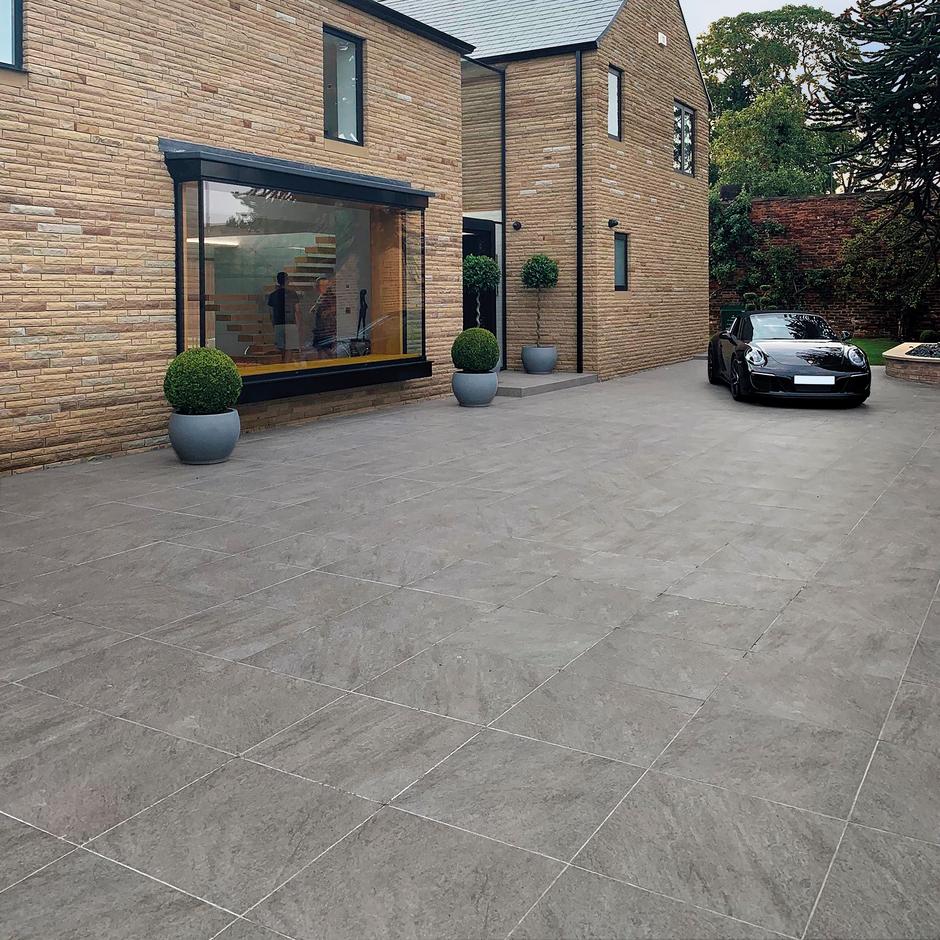 pietra serena grey porcelain paving tiles outside house