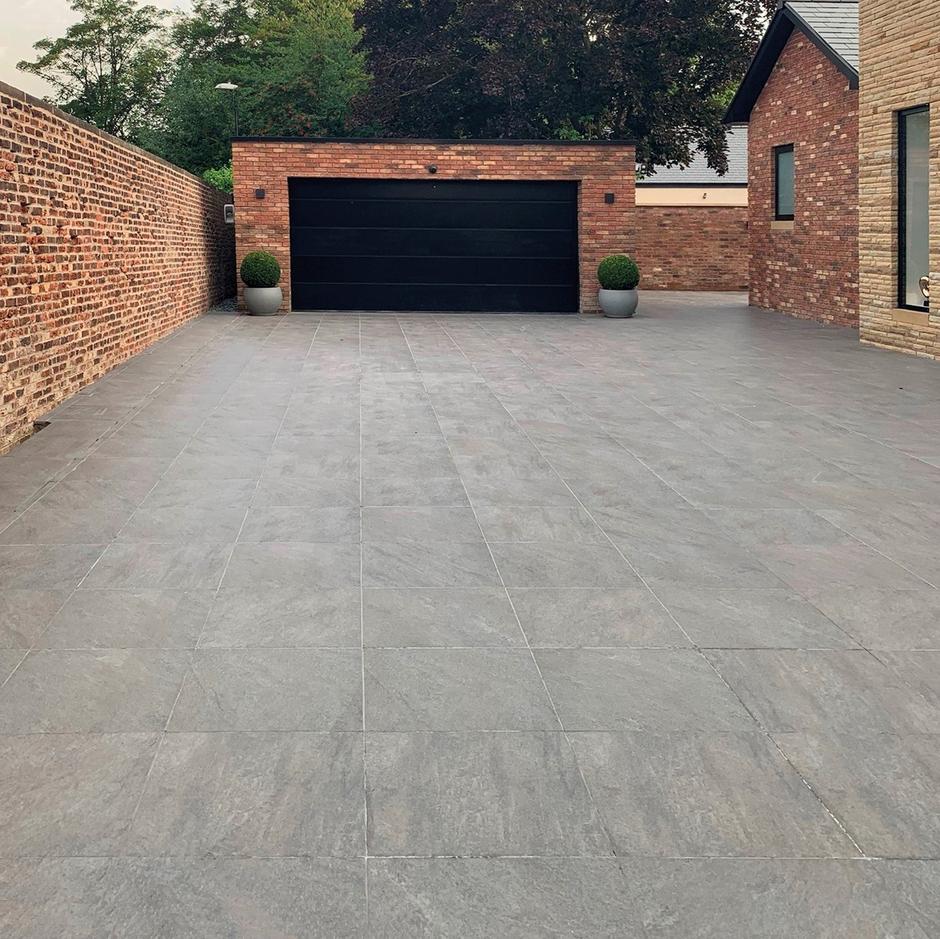 pietra serena grey porcelain paving with plants