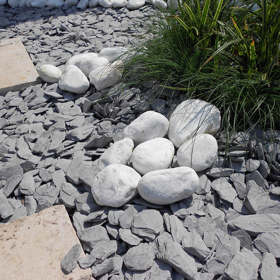 spanish white garden cobbles with blue slate in landscape