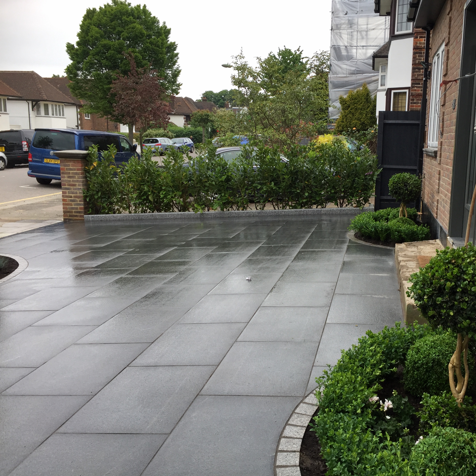Granite Paving patio with Granite Cobble Setts as Edging