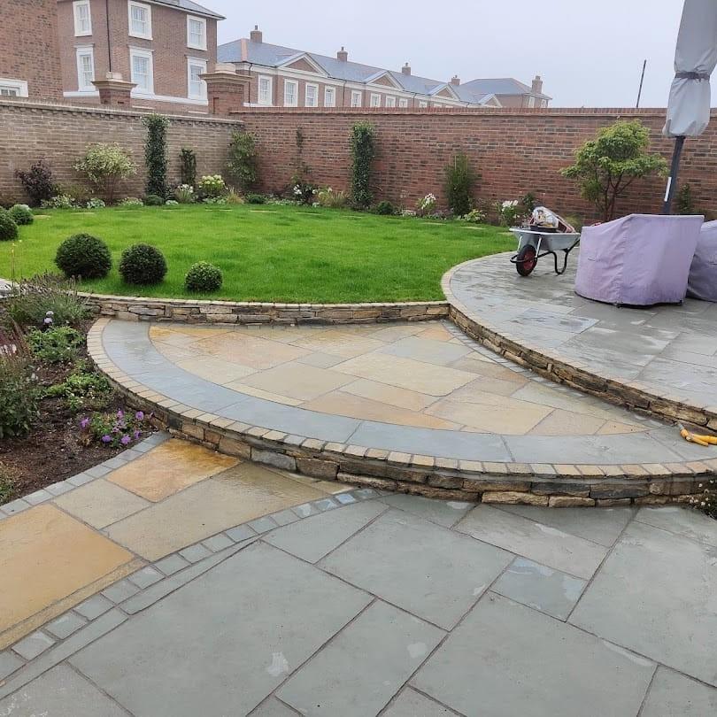 kota blue limestone paving laid with yellow limestone paving and grass