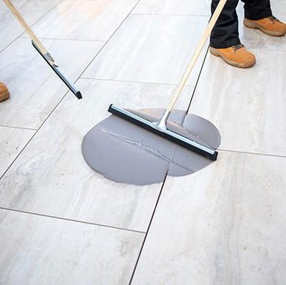 Landscapers installing EASYGrout Porcelain grout