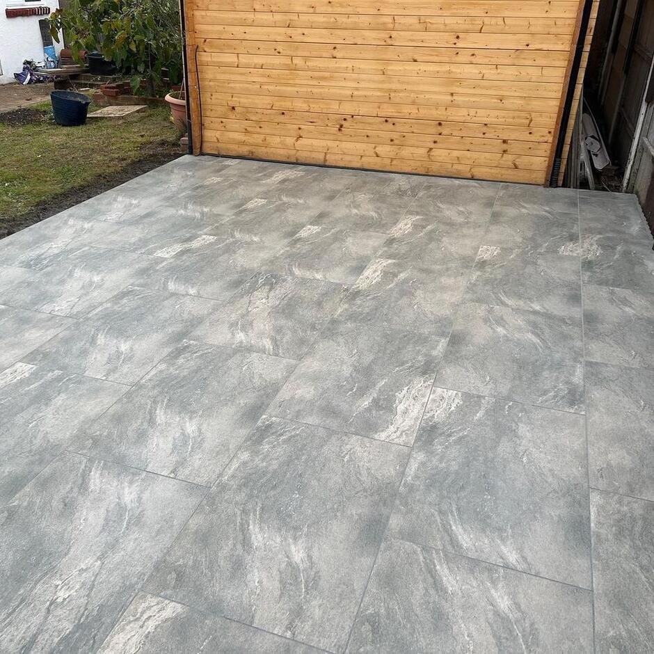 sienna jupiter grey in back garden with grass and wooden shed