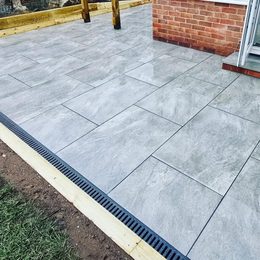 Sienna™ Jupiter Grey Porcelain Paving installed in garden