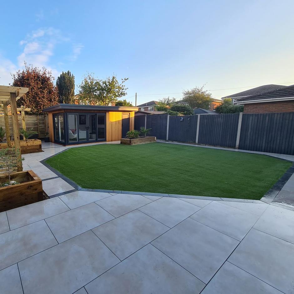 cappuccino paving in garden with grass and shed