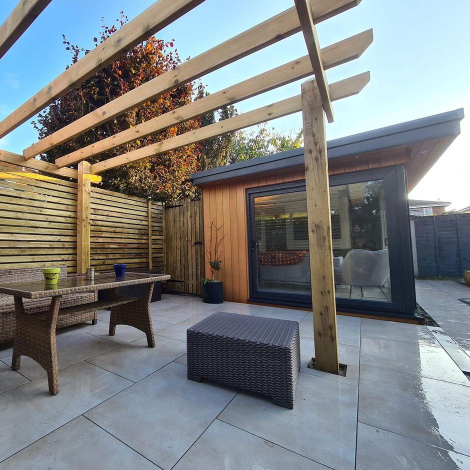 cappuccino paving in garden with grass and shed