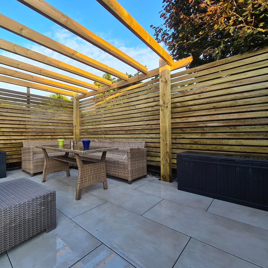 cappuccino paving in garden with grass and shed