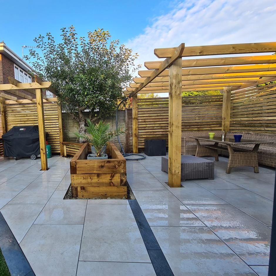 cappuccino paving in garden with grass and shed