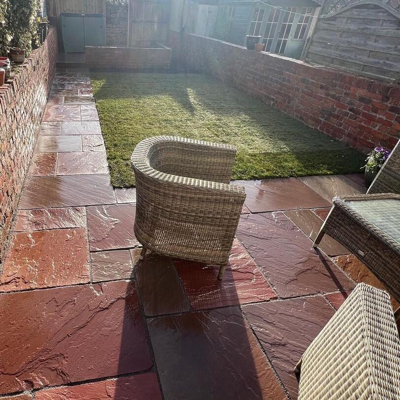 Heather Modak Sandstone Paving red paving stones with turf
