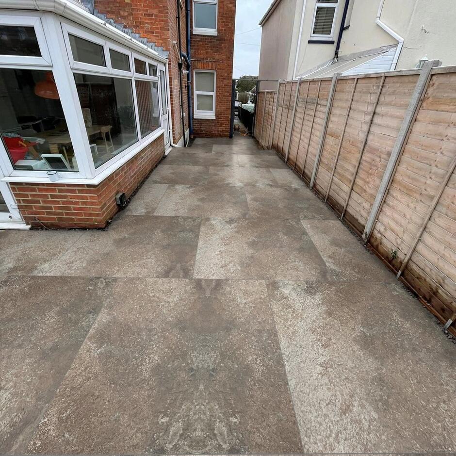 Sienna Caramel Mocha Porcelain Paving installed as a garden patio