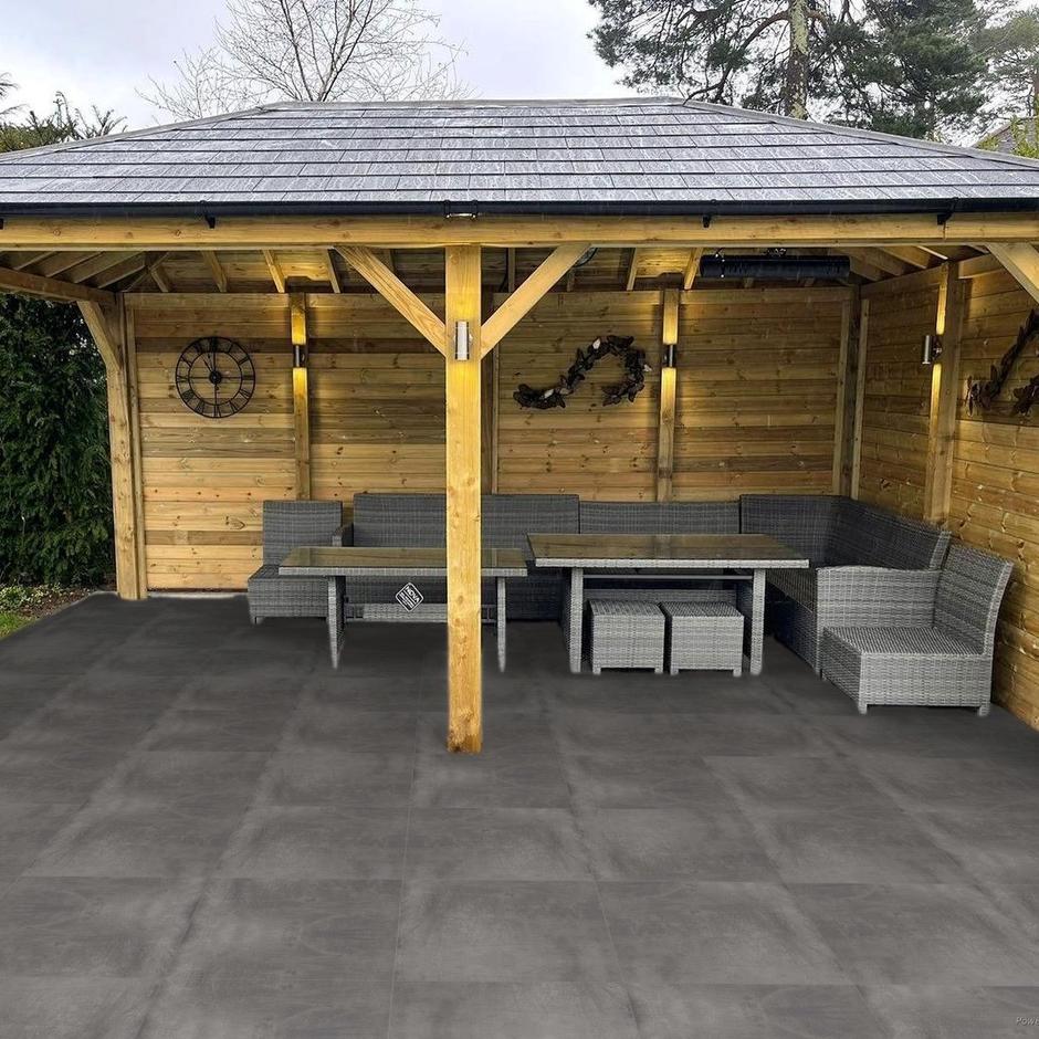 volcano black porcelain paving installed with garden furniture