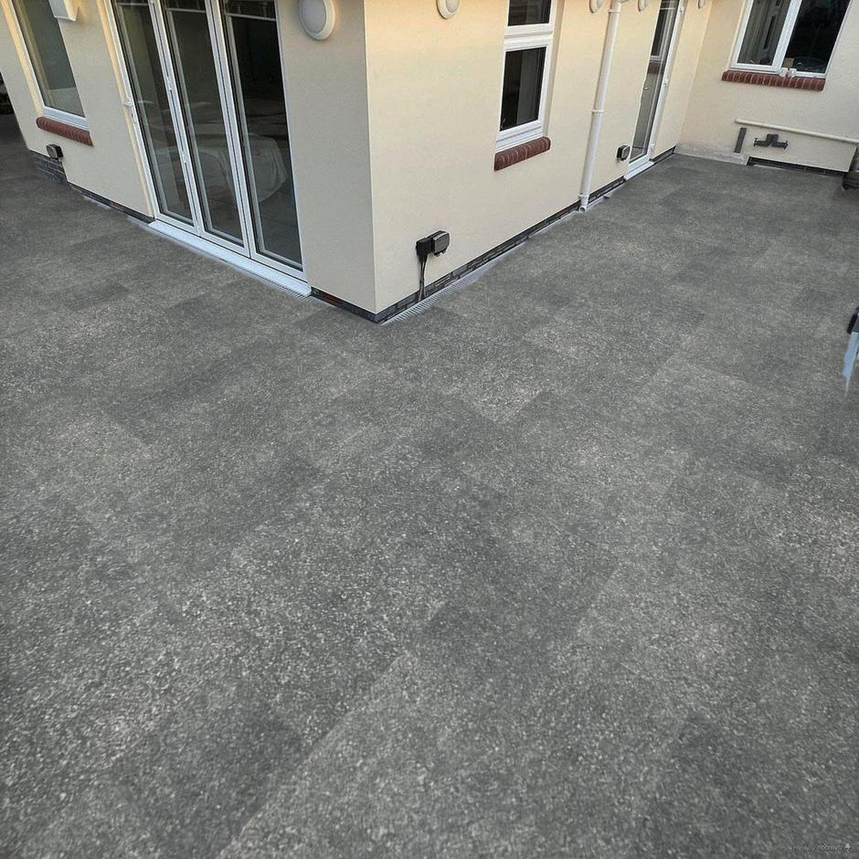 Jurassic Scuro Porcelain Paving in back garden