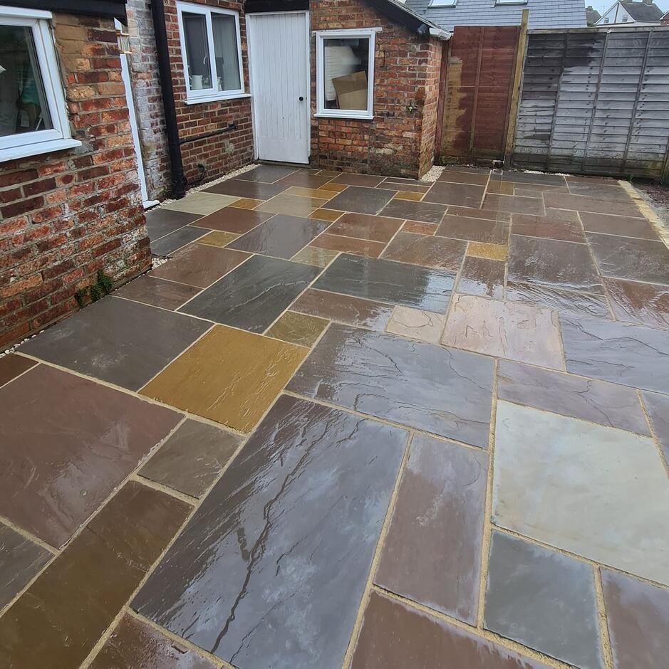 Fernlea Raj Green Sandstone Paving with paving grout back garden