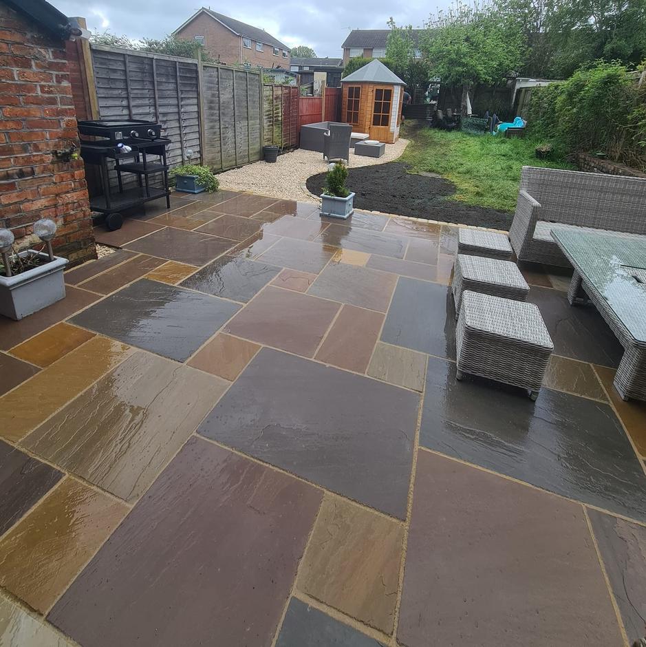 Fernlea Raj Green Sandstone Paving brown beige cream garden slabs with grouting outfoor furniture