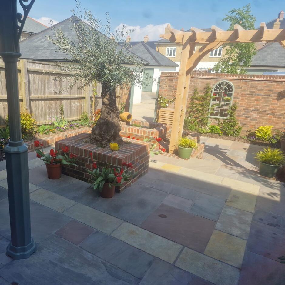 Fernlea Raj Green Sandstone Paving garden slabs with sleepers and fencing