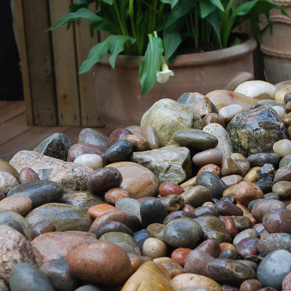 Tweed pebbles wet in garden