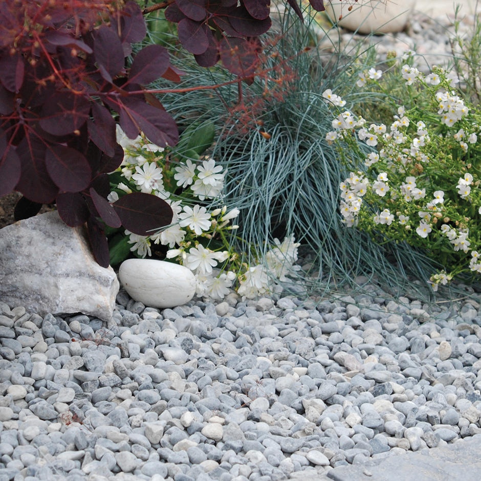 Ocean Blue Pebbles 20mm garden feature with plants
