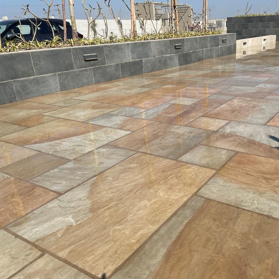 'Natural' Yorkstone Porcelain Paving installed in garden