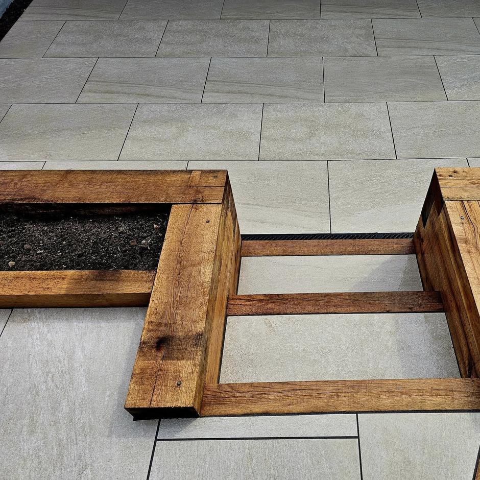 Pearl-silver paving slabs crafted from premium porcelain for outdoor charm