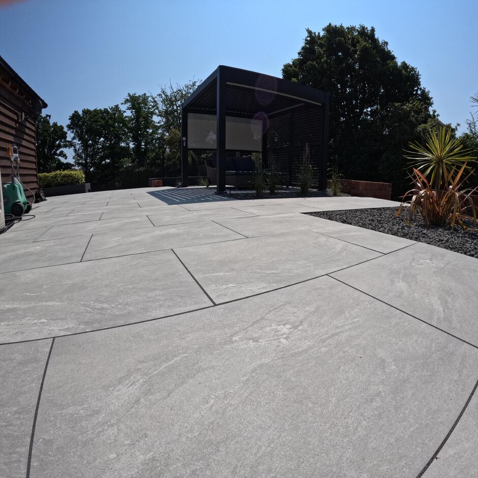 Sienna™ Jupiter Argent Porcelain Paving, mid grey porcelain tiles, summer patio cabin