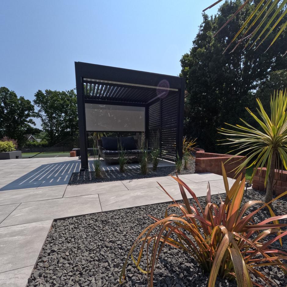 Black Basalt Chippings 20mm; black garden stones feature with plants