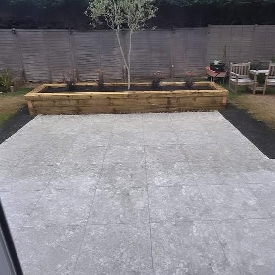 Terrazzano Blanco Porcelain Paving patio with planter beds