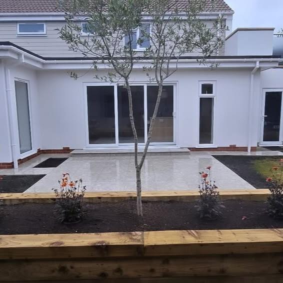 Terrazzano Blanco Porcelain Paving garden patio with plant beds