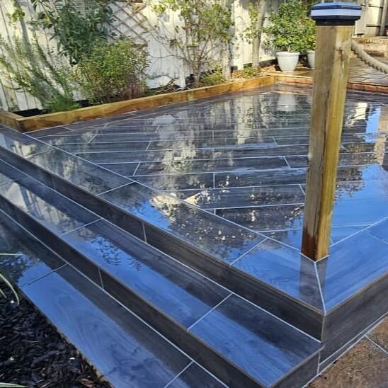 Woodland wood-effect Anthracite Grey Black Porcelain Paving Slab up-close garden steps